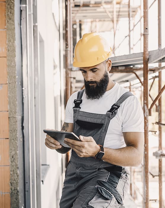 A commercial restoration contractor uses his tablet
