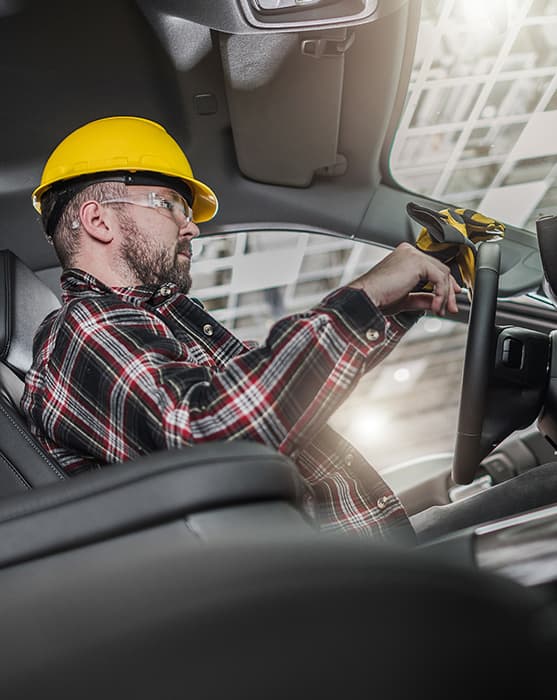 A commercial contractor in his work truck