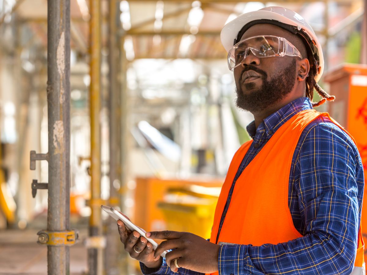 A restoration contractor uses a cloud-based software on the phone to take inventory.